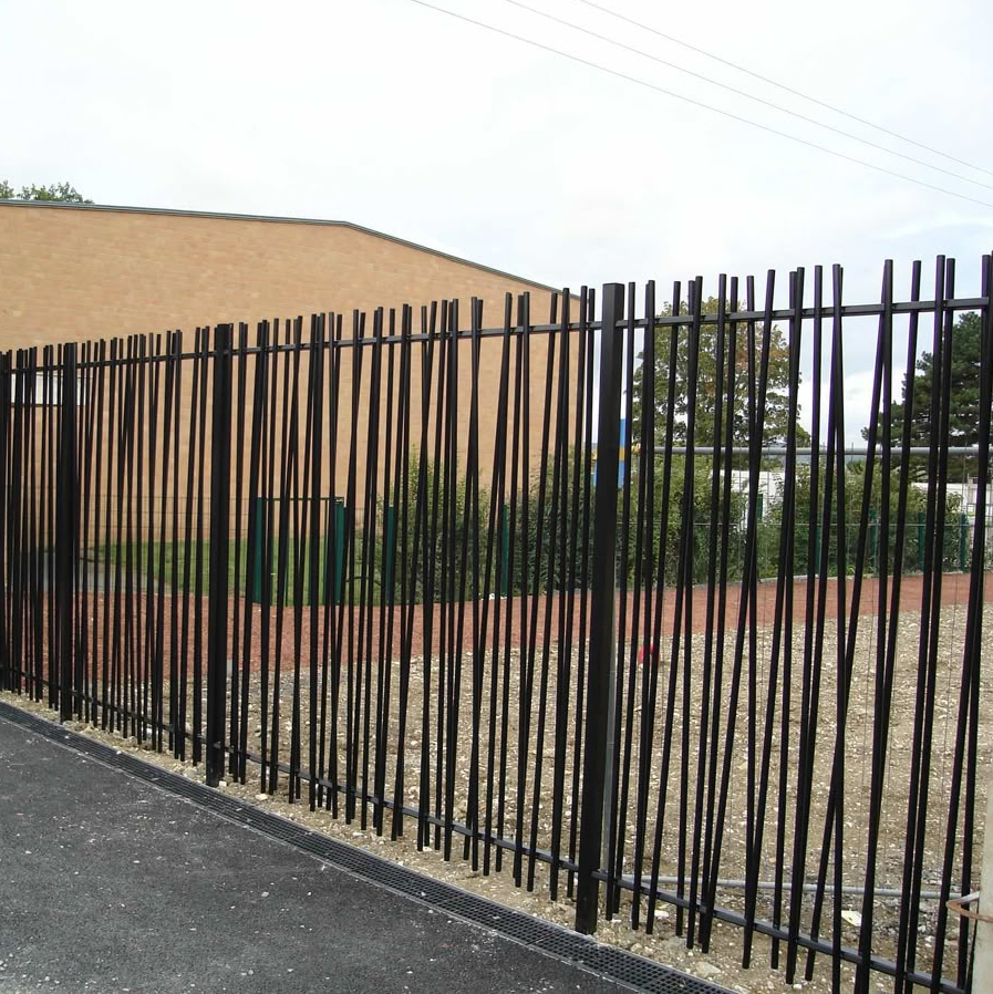 See-through fence of thin black vertical bars at slightly uneven angles.